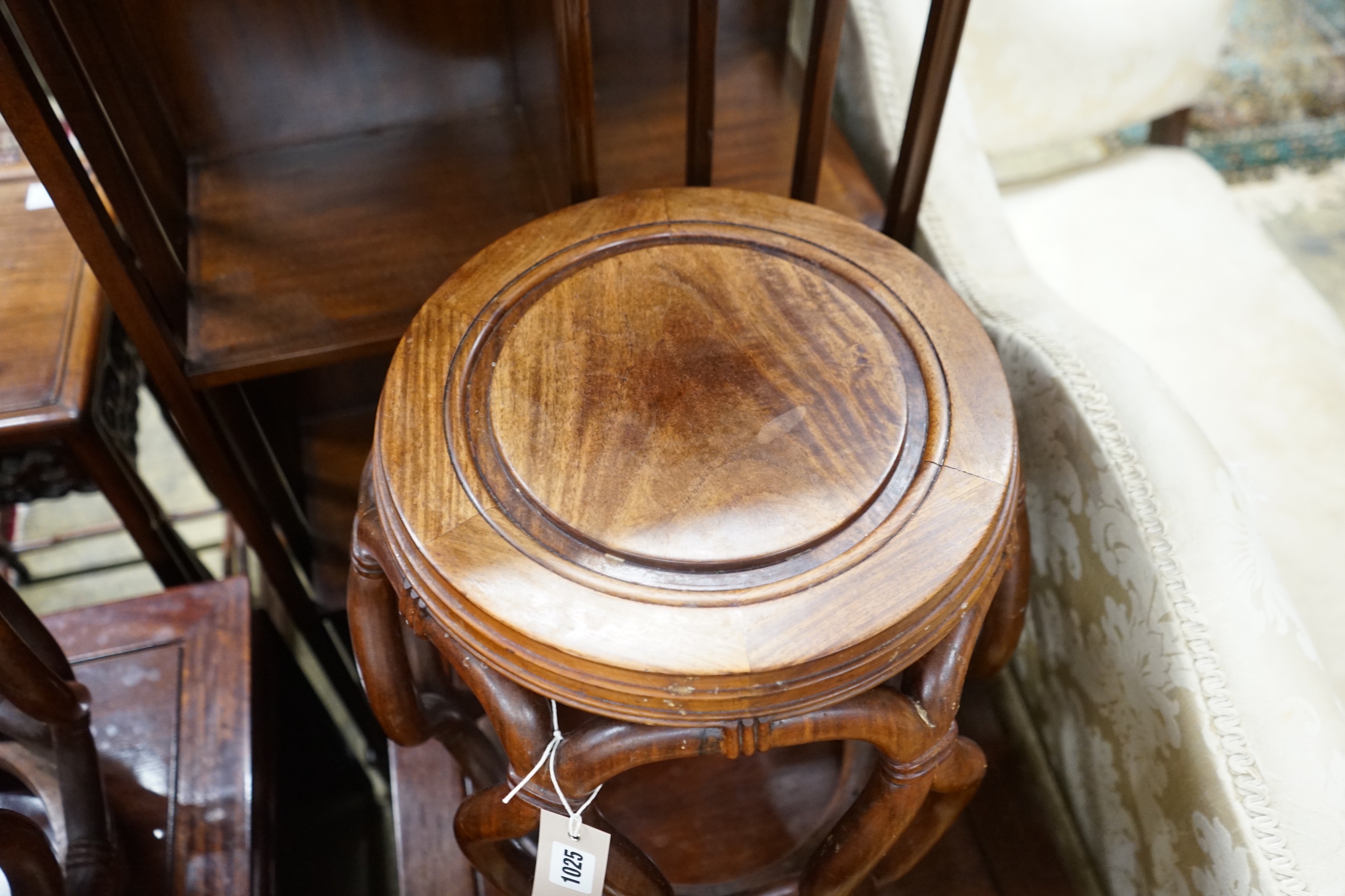 A pair of Chinese padouk wood jardiniere stands, diameter 38cm, height 46cm